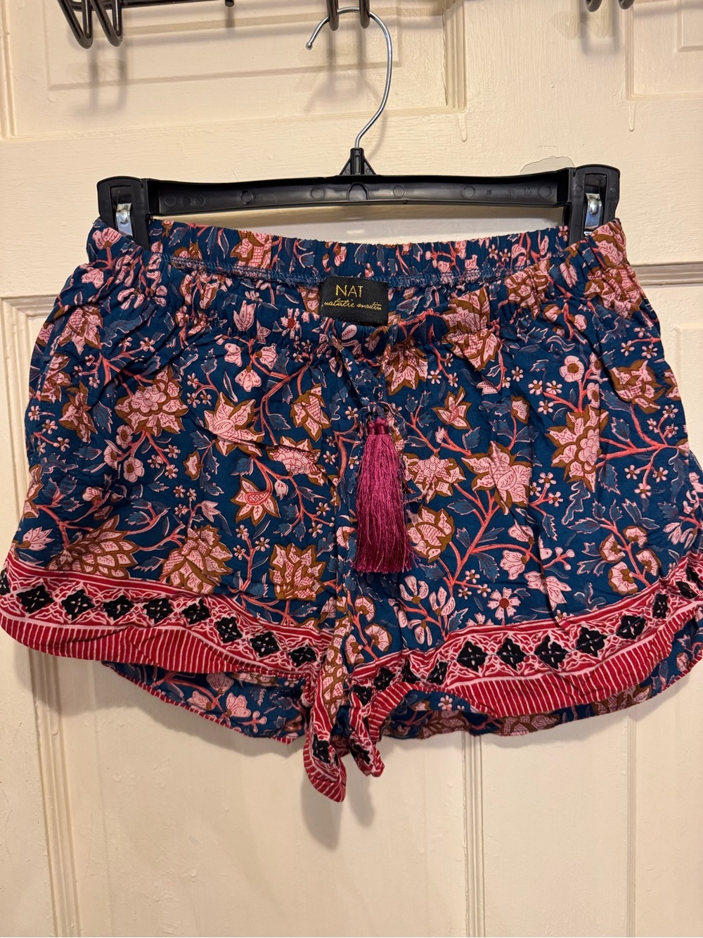 Natalie Martin navy floral shorts with pink tassel